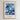 The image is a framed poster with a blue and white floral design. The poster contains a quote from the Bible, specifically Genesis 2:18, which states "It is not good to be alone."