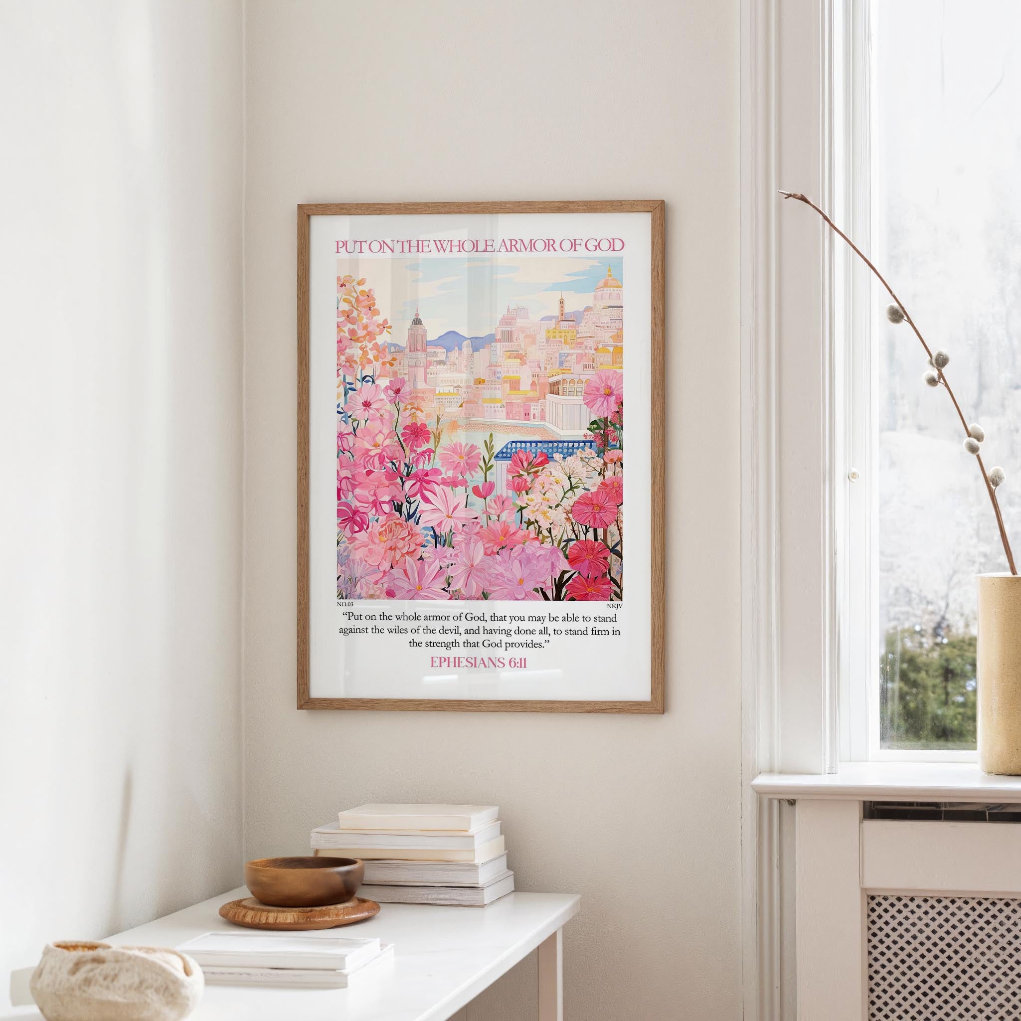 A framed poster of a colorful cityscape hangs on a wall, accompanied by a quote from Ephesians 4:1.