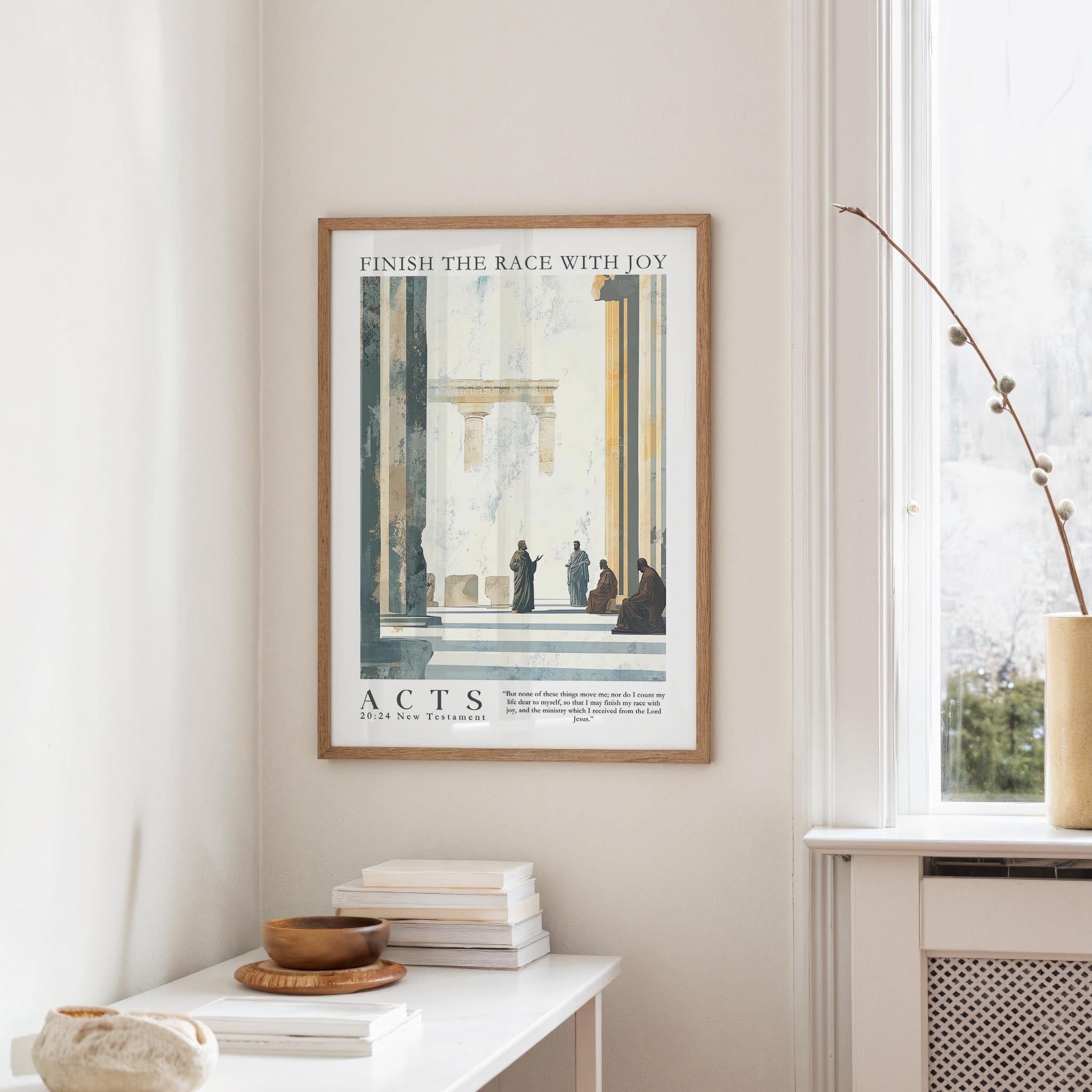 a framed poster of a classical architectural scene, hanging on a wall in a room with a white table and a window.