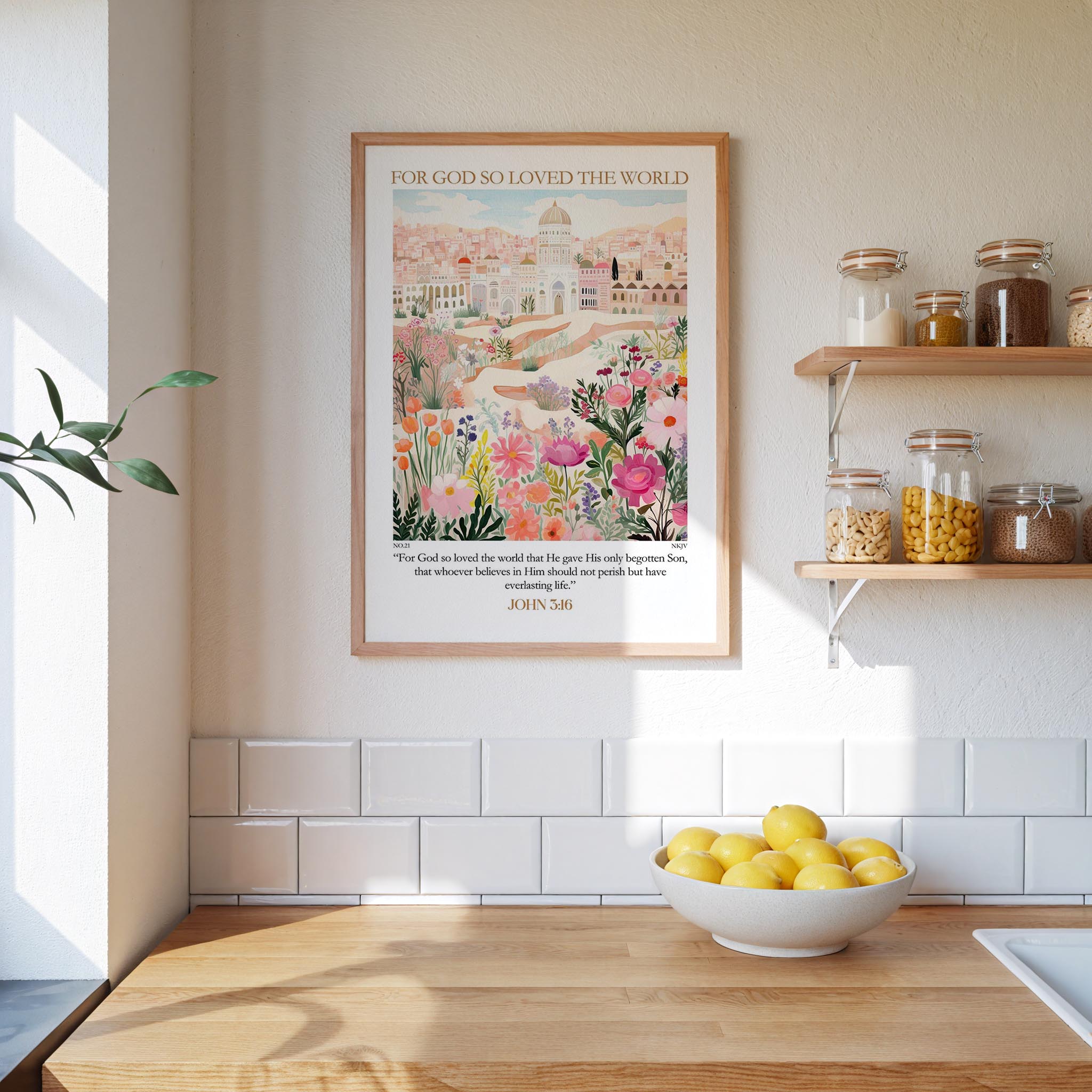 A framed poster of a cityscape with flowers hangs on a wall above a wooden countertop with a bowl of lemons.