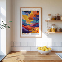a kitchen scene with a framed poster of a colorful landscape hanging on the wall above a wooden countertop with a bowl of lemons.