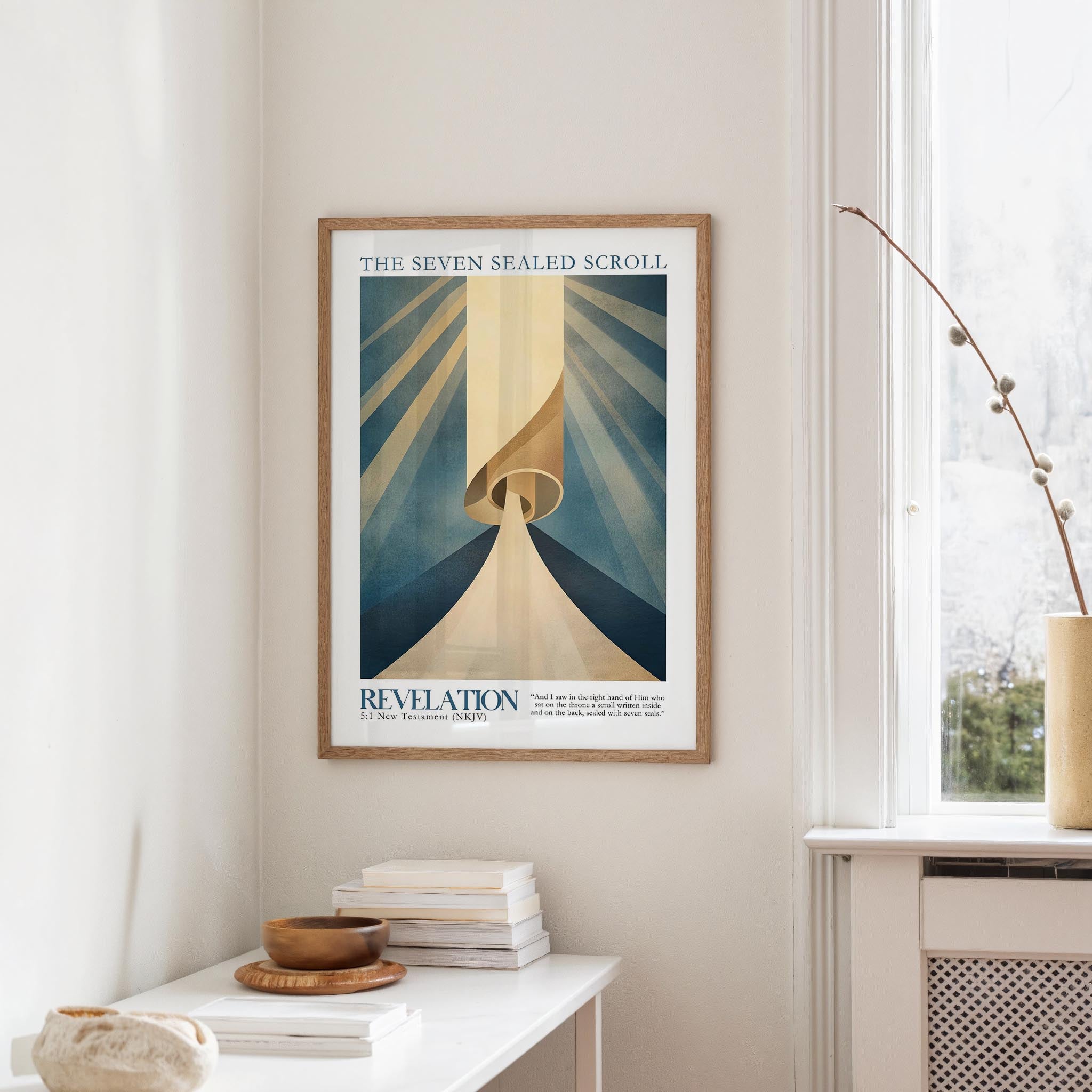 a framed poster of a spiral design hanging on a wall, with a window and a small table with books and a vase in the foreground.