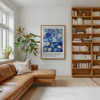 a cozy living room with a brown leather sofa, a large window, a wooden bookshelf filled with books, and a framed poster on the wall.