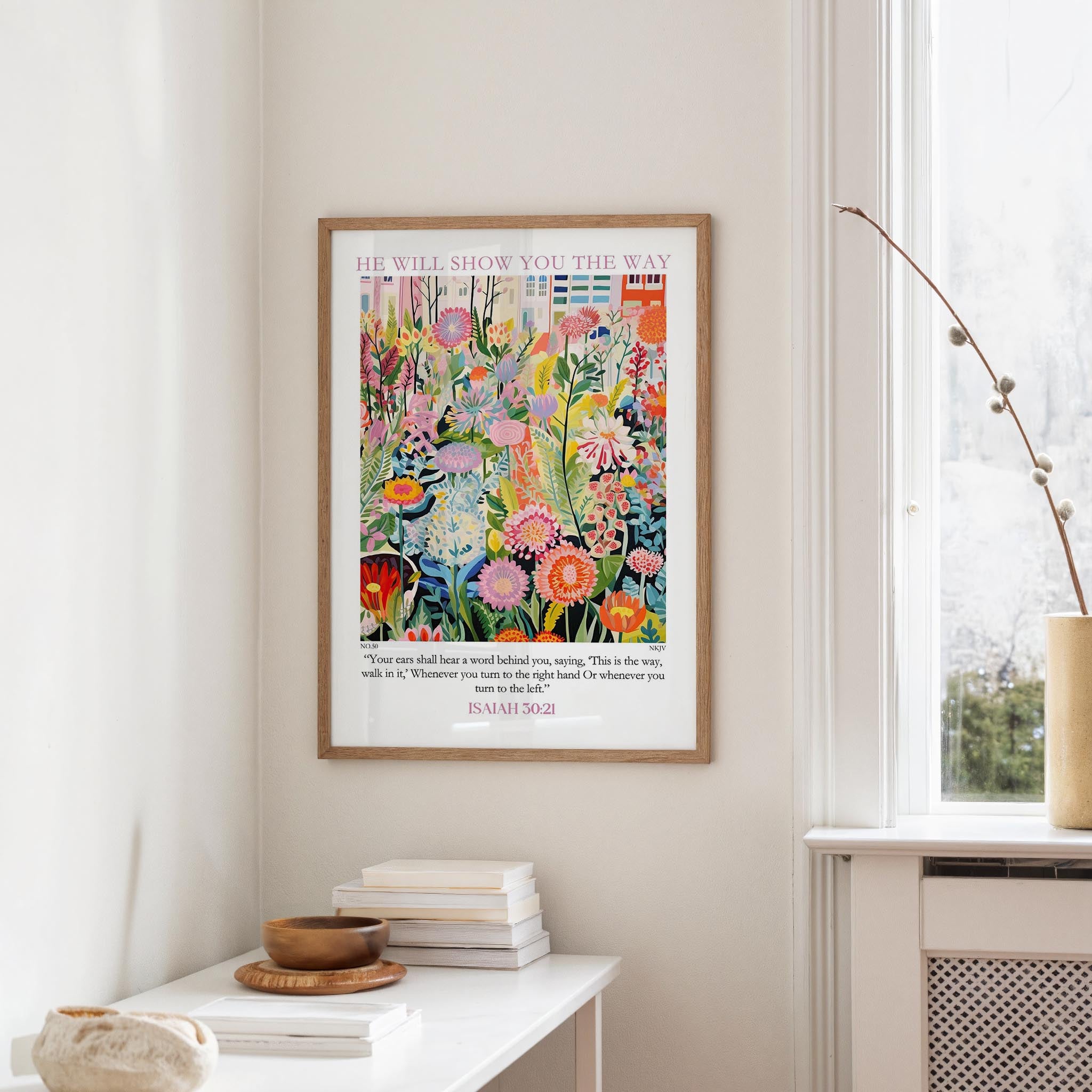 a vibrant, colorful painting of flowers hanging on a wall, with a quote from Isaiah 30:21 below it.