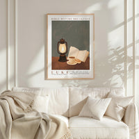a framed poster of a lantern, a book, and a cup on a table, hanging on a wall above a white couch.