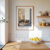 a kitchen scene with a framed poster of a group of people in a church, a bowl of lemons, and shelves with various jars and containers.