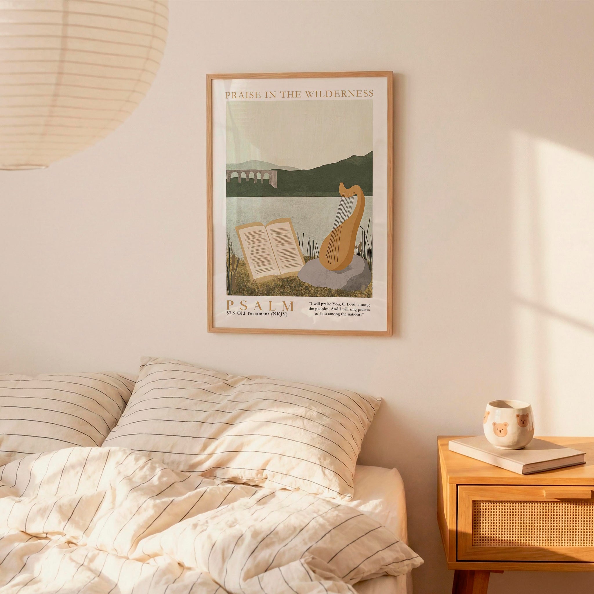 A framed poster of Psalm 19 hangs on a wall above a bed with striped bedding.