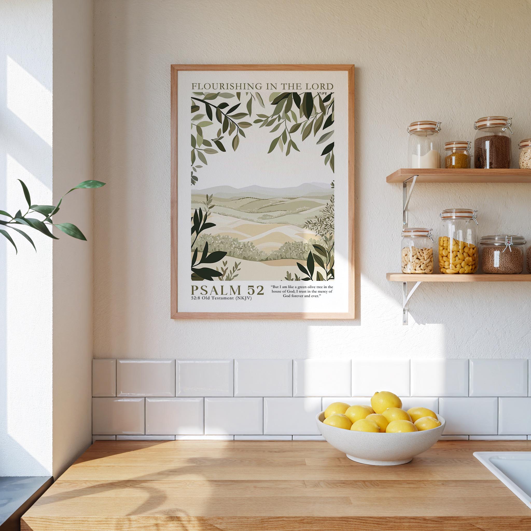 a kitchen scene with a framed poster of a landscape on the wall, a bowl of lemons on the counter, and shelves displaying various jars and containers.