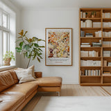 a cozy living room with a brown leather sofa, a large bookshelf filled with books, and a framed poster on the wall.