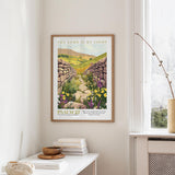 a framed poster of a stone path leading through a field of flowers, with the text "THE LORD IS MY LIGHT" and "PSALM 27" below it.