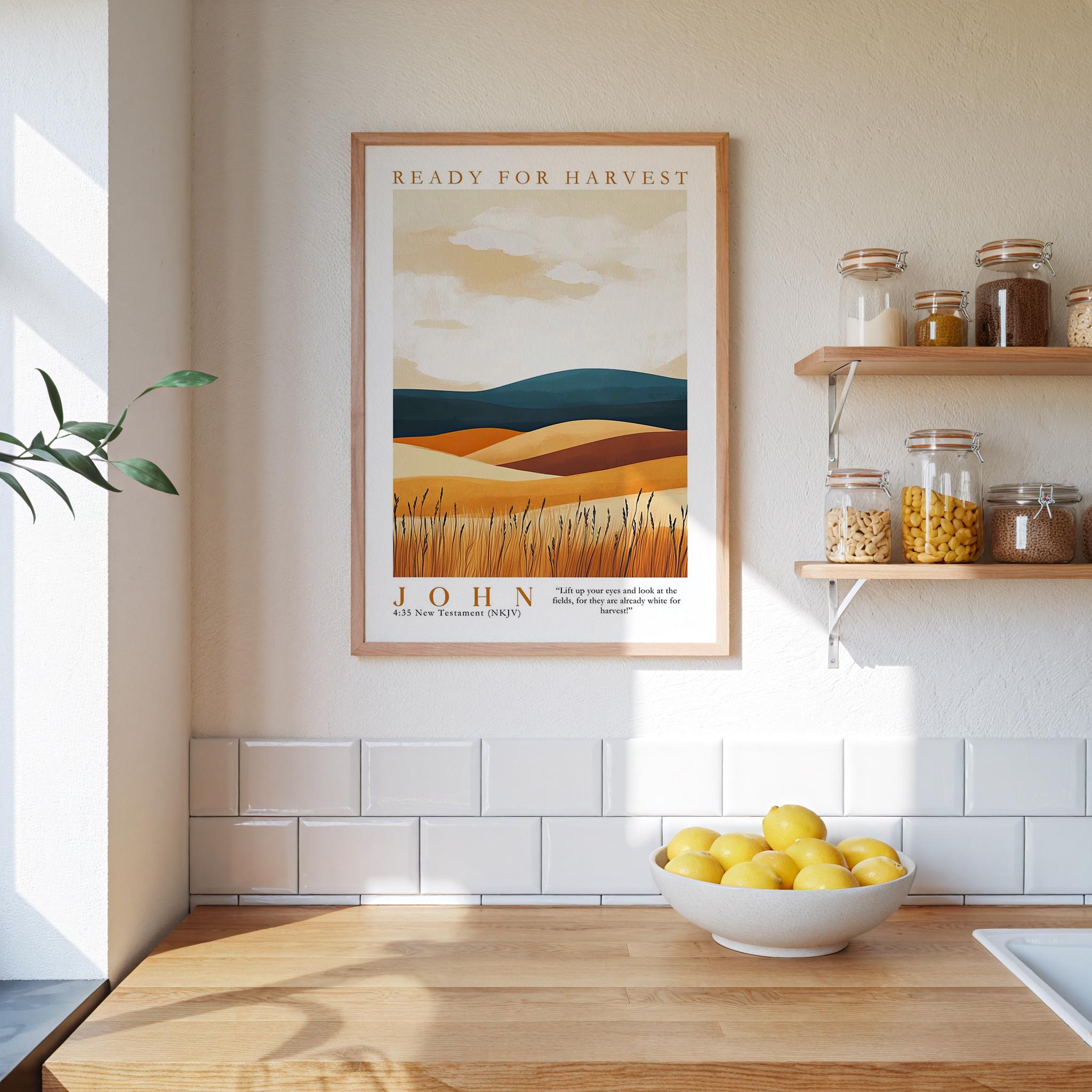 a kitchen scene with a framed poster of a desert landscape hanging on the wall above a wooden countertop with a bowl of lemons.