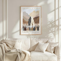 a framed poster of a mountain landscape with a group of people gathered around it, hanging on a wall above a white couch.