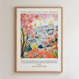 The image is a framed poster depicting a colorful illustration of a cityscape with a fruit tree in the foreground.