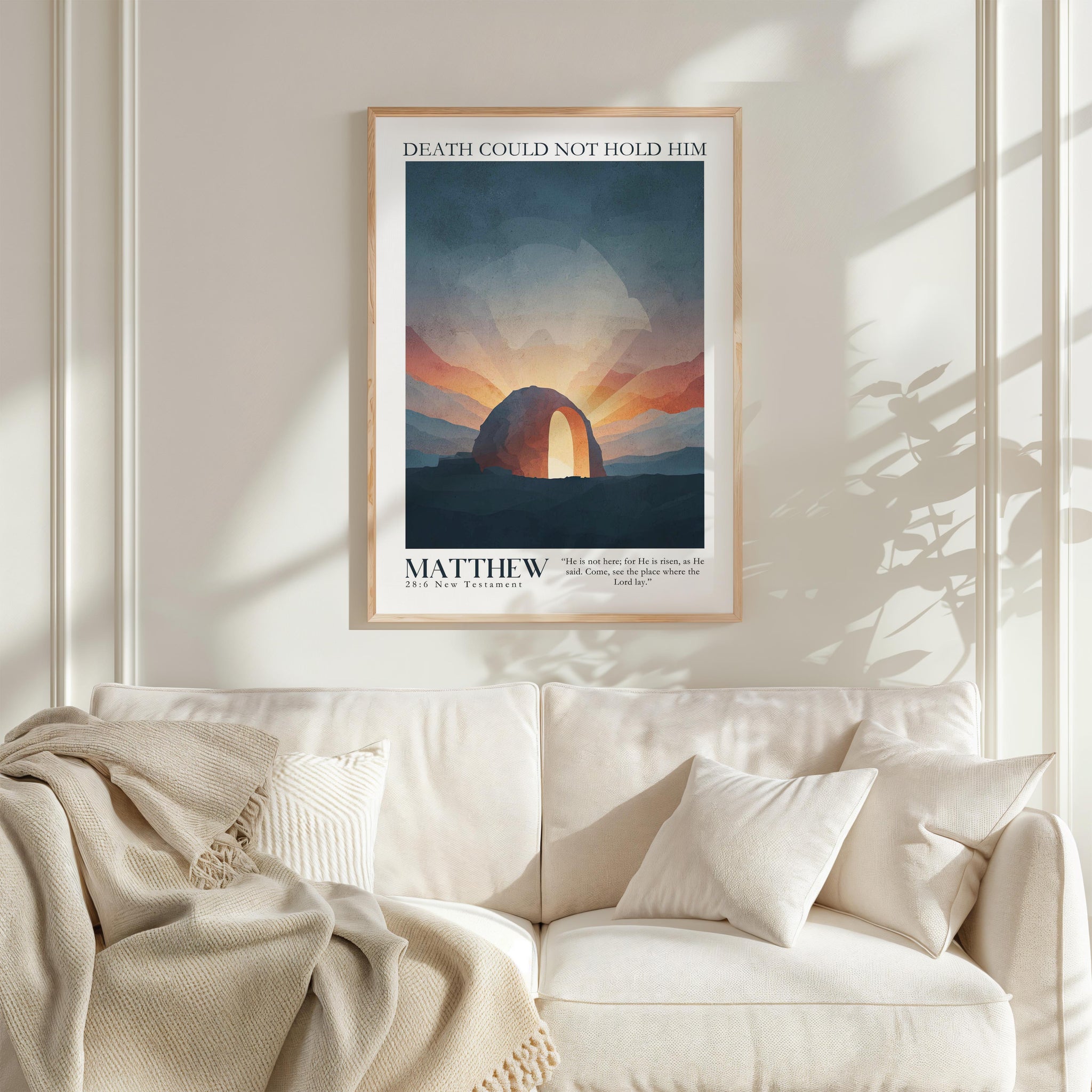 a framed poster of a sunset over a desert landscape, with the text "DEATH COULD NOT HOLD HIM" and "MATTHEW" below the image.