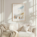 a poster of a religious scene with a group of people, and it is hanging on a white wall above a white couch.