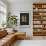 a cozy living room with a large bookshelf filled with books, a comfortable leather sofa, and a framed poster on the wall.