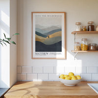 a kitchen counter with a bowl of lemons, a framed poster of mountains, and a shelf with jars and containers.