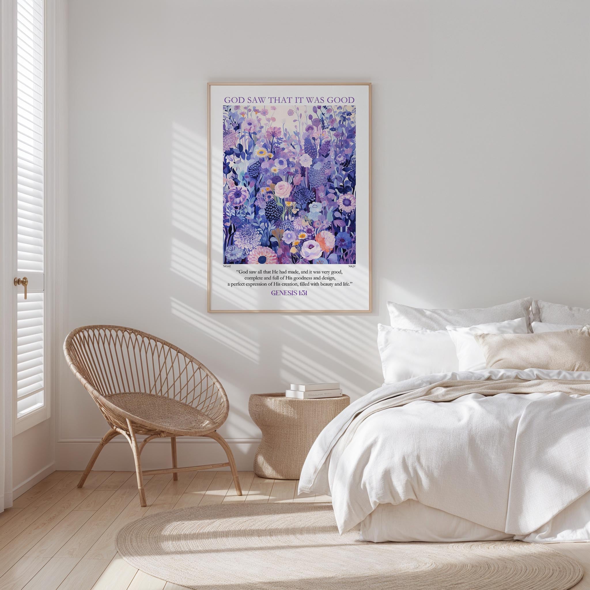 A bedroom with a bed, a woven chair, and a framed poster of a floral design on the wall.