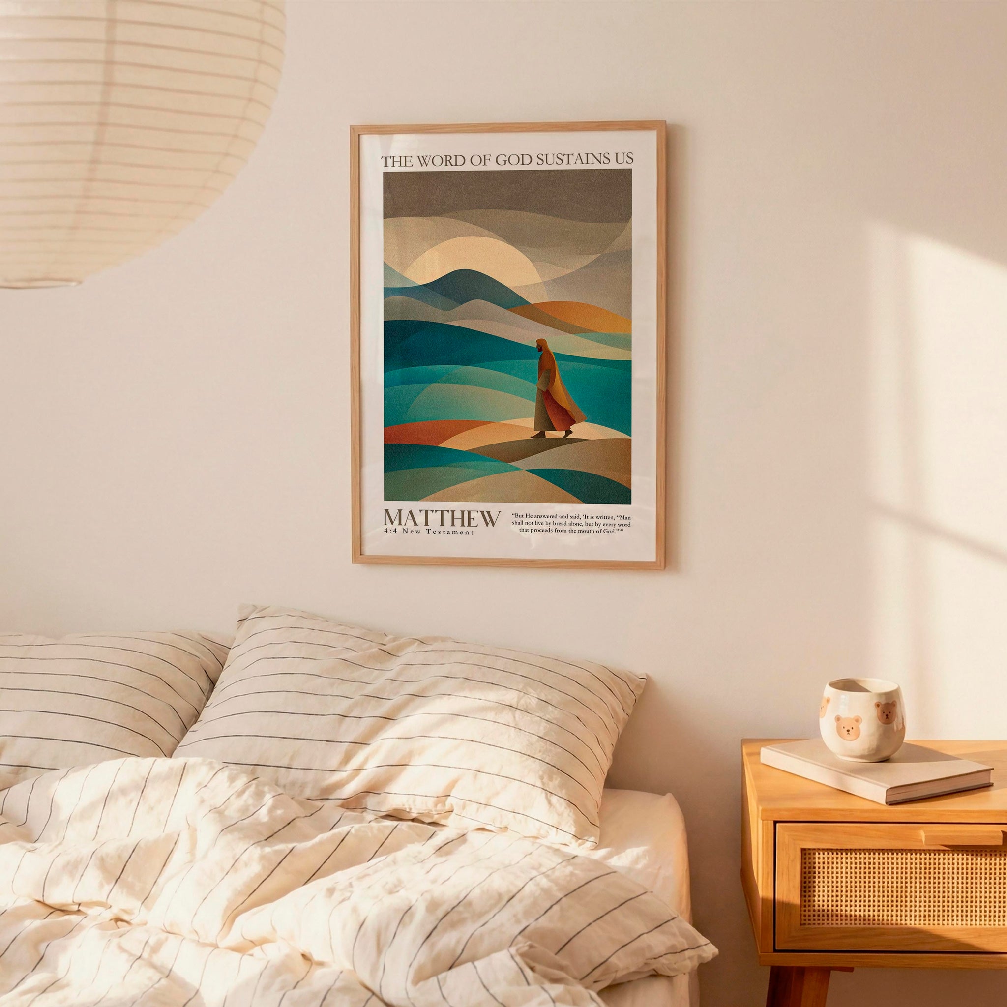 a bedroom scene with a framed poster of a person walking on a beach, a bed with striped pillows, a nightstand with a coffee mug and a book, and a hanging lamp.