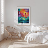 A bedroom with a bed, a woven chair, and a colorful abstract poster on the wall.