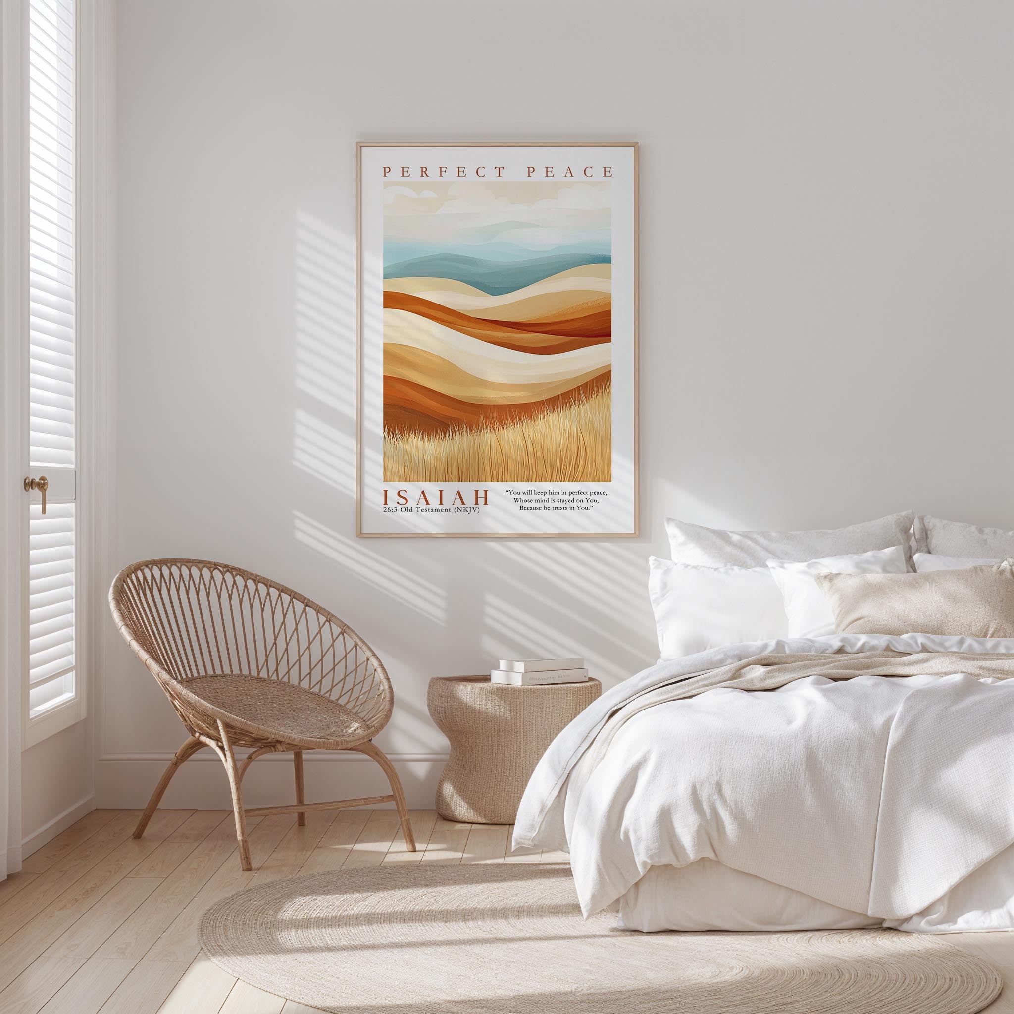 A bedroom with a bed, a woven chair, and a framed poster of a landscape on the wall.