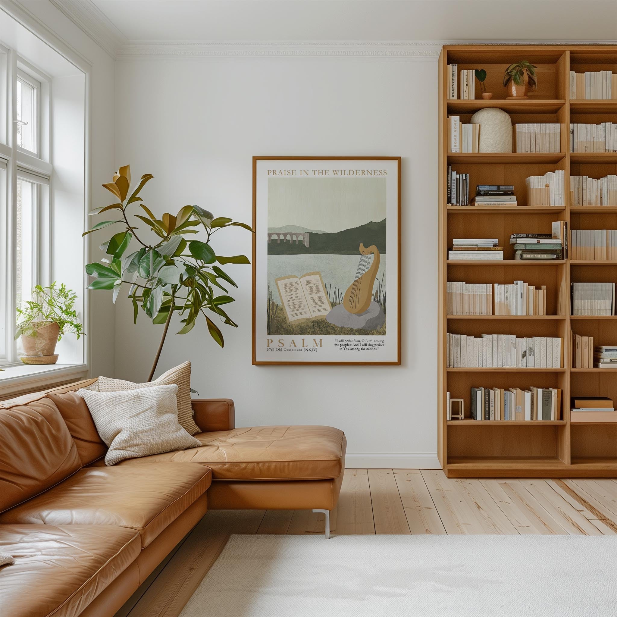 a cozy living room with a large bookshelf filled with books, a comfortable leather sofa, and a framed poster of a cat and a book titled " Psalm".