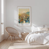 A poster of a large crowd of people is hanging on a wall in a bedroom, with a bed and a woven chair in the foreground.